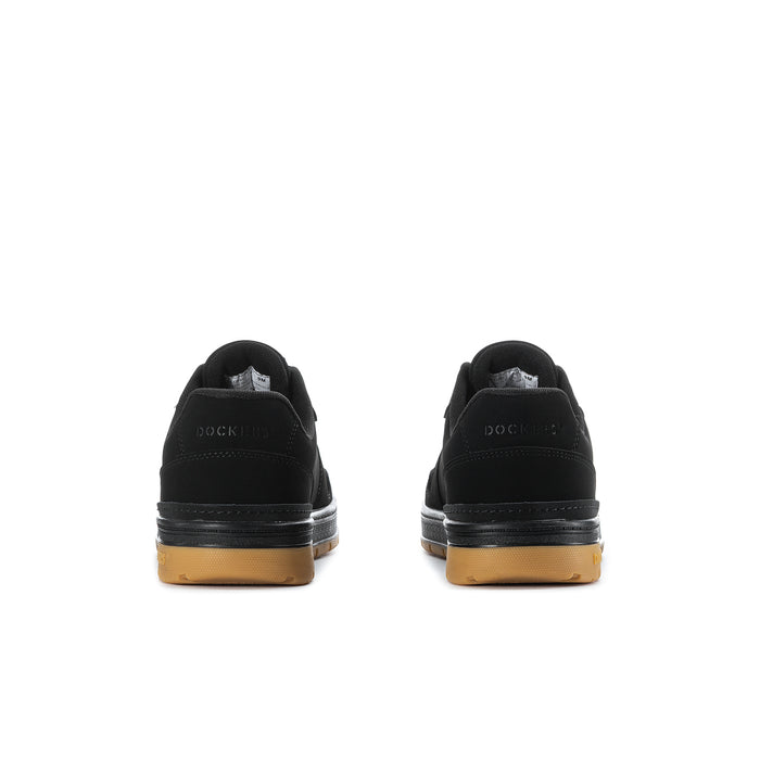 Black low-top sneakers with gum midsole and heel tabs; rear view.