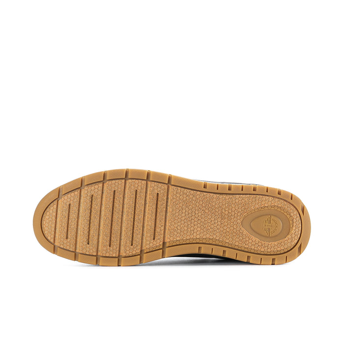 Outsole view of black low-top sneakers with tread pattern and gum color.