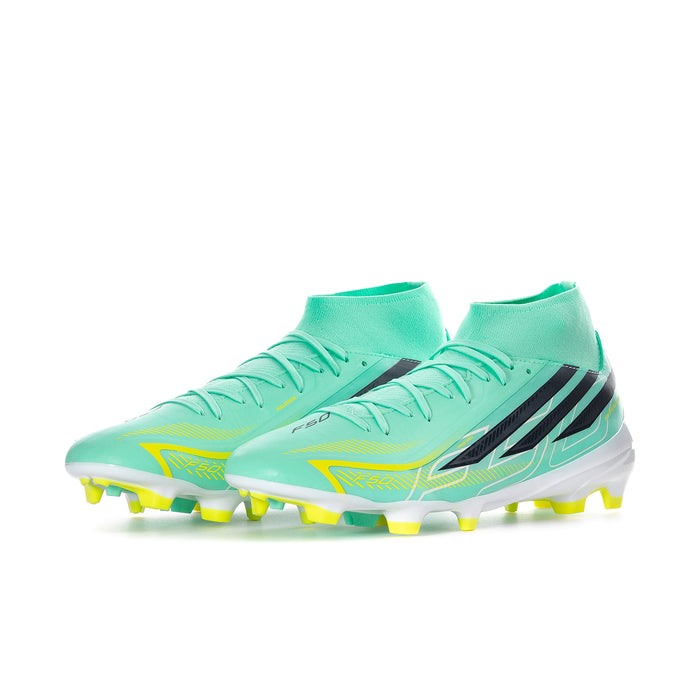 Men's mid-cut soccer cleats, mint upper with black accents and yellow outsole studs