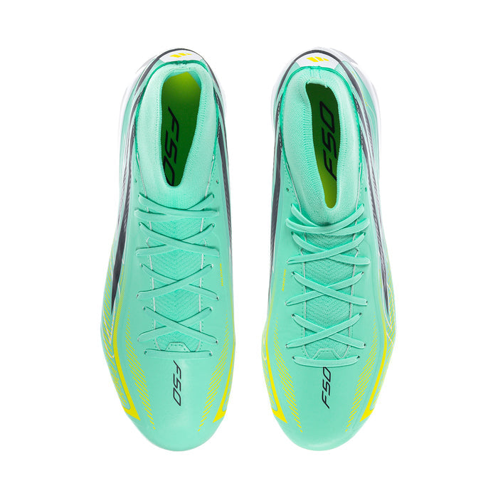 Pair of mint mid-cut soccer cleats with lace-up front, black stripe details