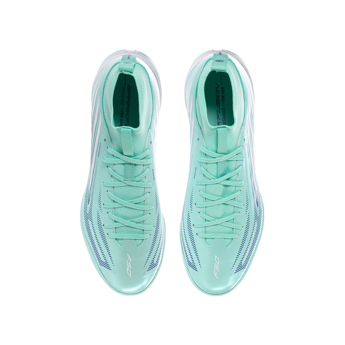 Pair of youth soccer cleats, mint uppers with white laces and cushioned interior