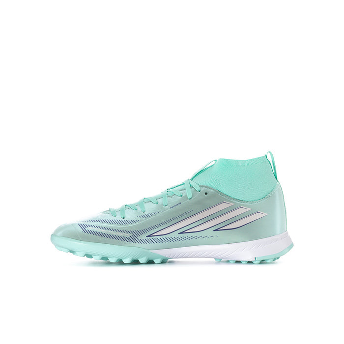 Youth soccer cleats in mint and white, front angle with lace-up top and studs