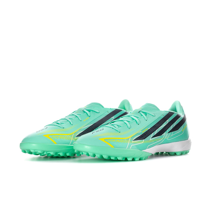 Mint soccer turf cleats with black stripes and neon yellow details, lace-up