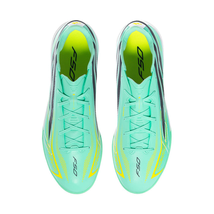 Pair of mint soccer turf cleats, top view with neon yellow accents and black graphics