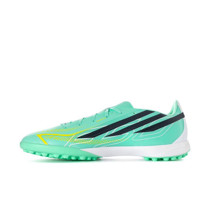 Front 3/4 view of mint soccer turf cleat with black stripes and neon yellow accents