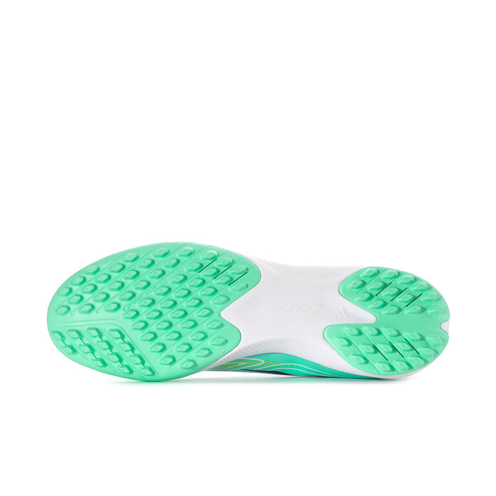 Bottom view of mint soccer turf cleats with green rubber studs