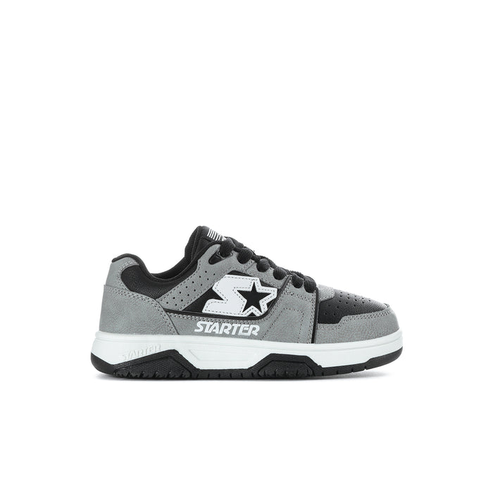 Kids low-top sneakers with gray leather panels, black laces, and star logo