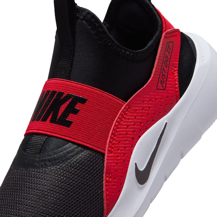 Kids running sneaker close-up, black knit with red strap and Nike Swoosh