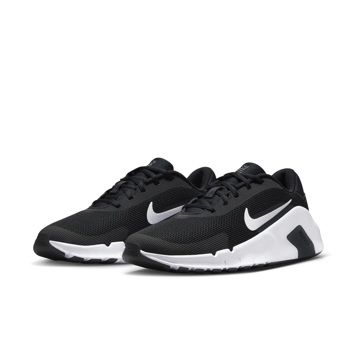 Pair of women's training sneakers in black with white midsole and Nike swoosh