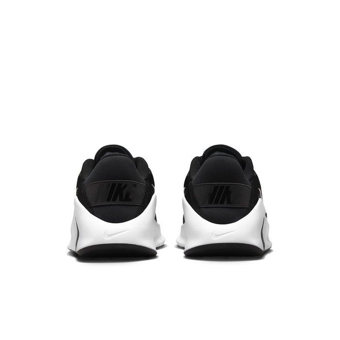 Women's black training sneakers, heel view with white midfoot and Nike logo