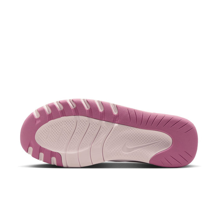 Women’s pink and white training shoe outsole with tread pattern, underside view.