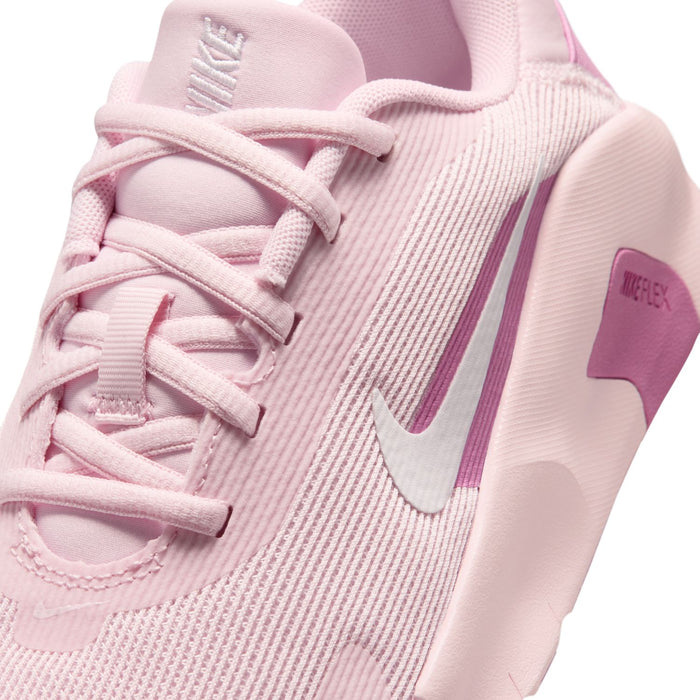 Women’s pink knit training sneaker close-up, lace-up detail and Nike Swoosh.