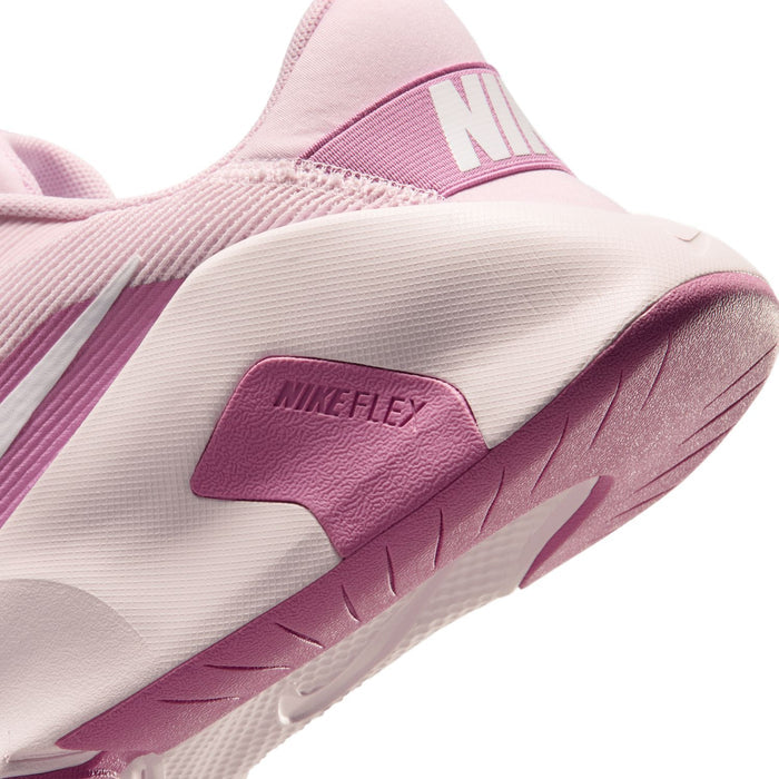 Women’s pink and white training sneaker close-up, Flex foam heel panel and tread.