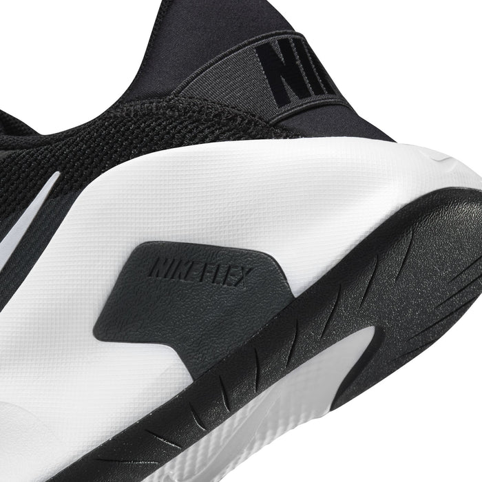 Women's outsole close-up with NIKE FLEX text on white foam and black tread