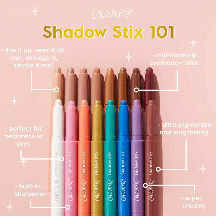 Flex ColourPop Shadow Stix eyeshadow stick shown tip-up beside a rainbow lineup on a blush pink background, spotlighting a creamy, ultra‑pigmented, long‑wear, multi‑tasking formula with a built‑in sharpener for beginners or pros.