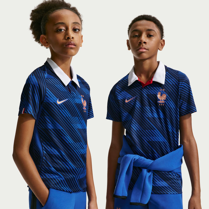 Youth France blue home jersey with white polo collar, Nike logo, and red rooster crest