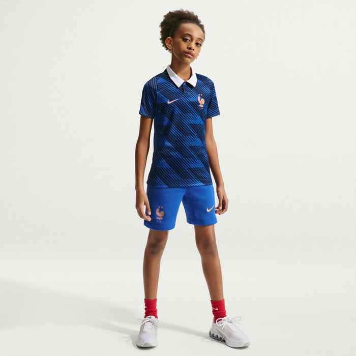 Youth France home kit: blue striped polo jersey with white collar and matching blue shorts