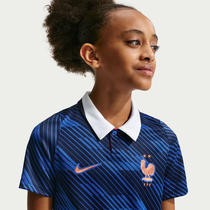 Youth France home jersey close-up: white collar, Nike swoosh, and red rooster crest