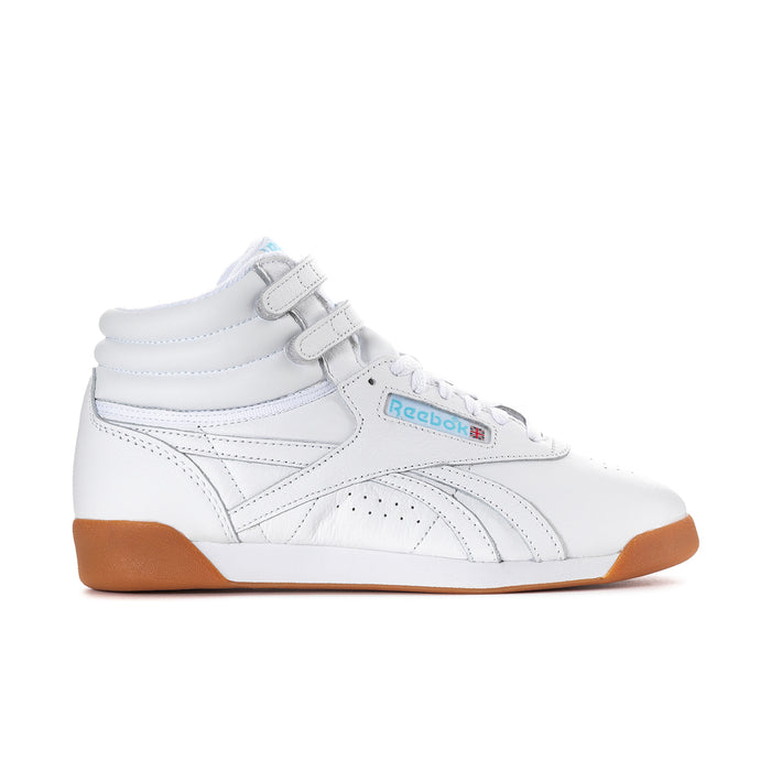 White high-top sneakers with blue accents, lace-up and strap; Reebok logo