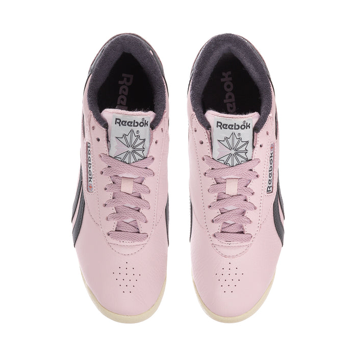 Women's pink low-top sneakers with lace-up front and Reebok logo on tongue