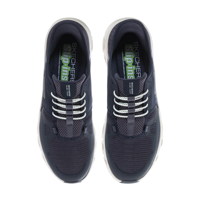 Men's navy sneakers showing interior lining and lace-up pattern across tongues.