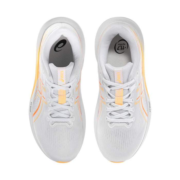Pair of white running shoes with lace-up closure and coral details on the tongues