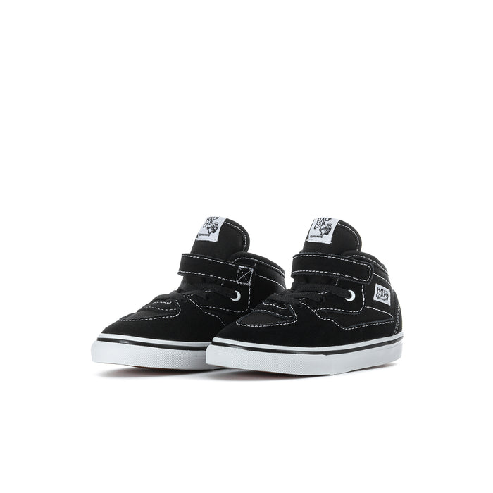 Pair of toddler half-calf black sneakers with Velcro strap and white rubber toe and sole