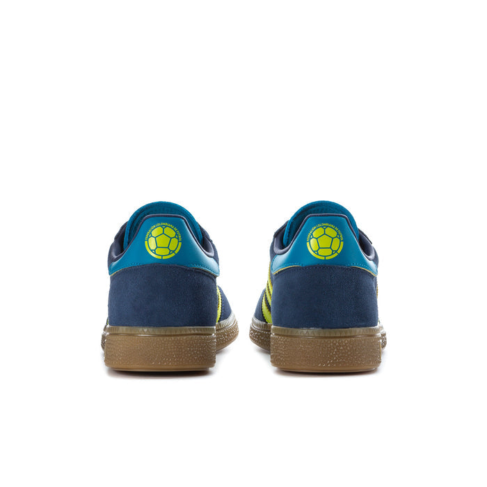 Men's sneakers heel view: navy suede, teal collar, and neon green heel logo