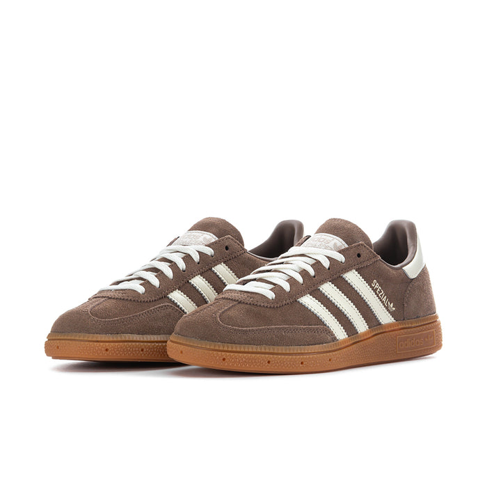 Brown suede low-top sneakers with white triple stripes and gum outsole