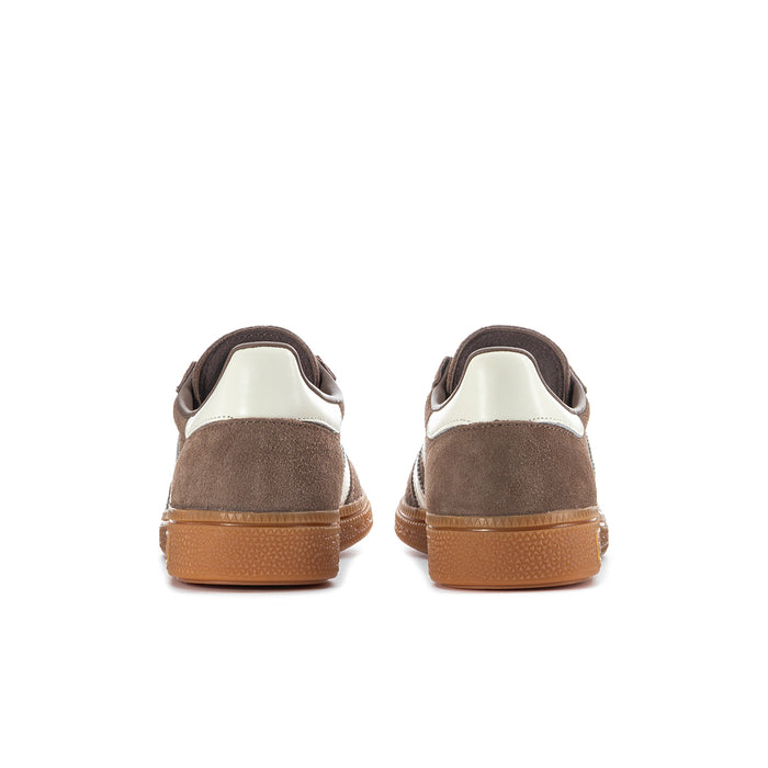Brown suede sneakers with white heel lining and tan gum heel