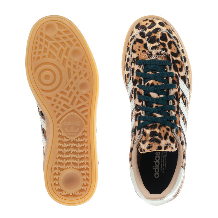 Women's adidas sneaker outsole and heel view, leopard upper with teal laces and gum sole