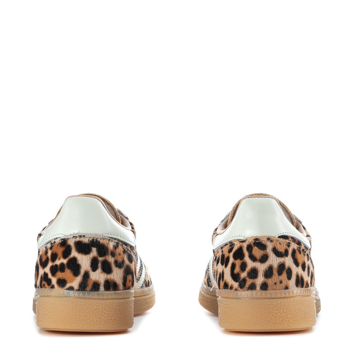 Women's adidas sneaker back view with leopard heel and white collar trim, gum sole
