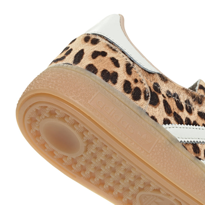 Women's adidas sneaker close-up of sidewall, leopard fabric with textured gum sole