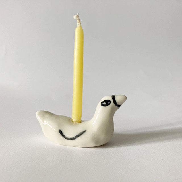 Ceramic duck cake topper candle holder with yellow candle; white duck with black eyes