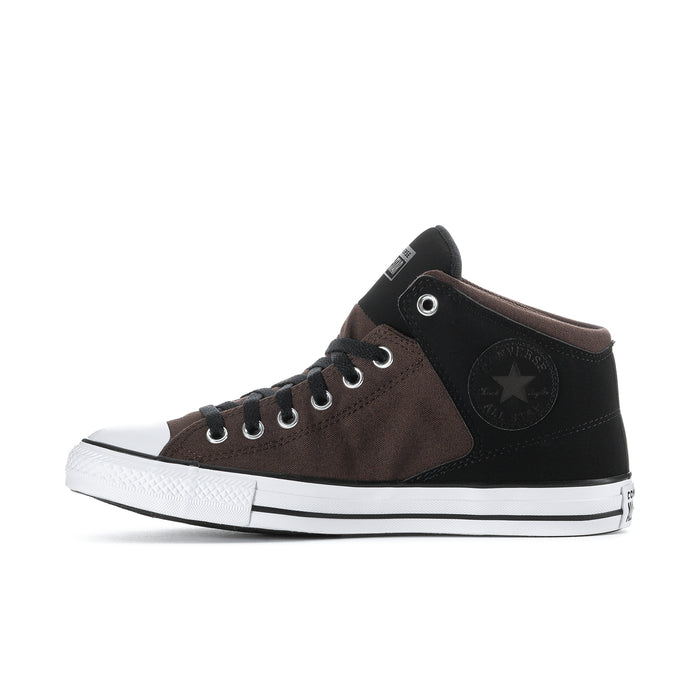Side view of mid-top sneakers in brown and black with lace-up eyelets and star patch