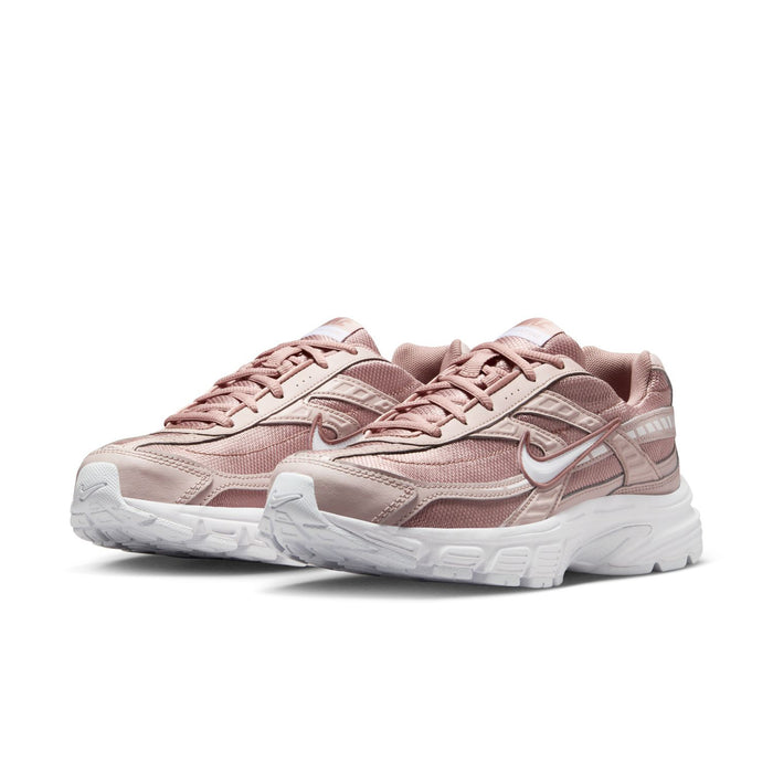 Women's dusty pink lace-up sneakers, side view, white cushioned sole