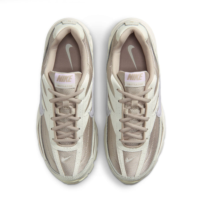 Women's cream and beige lace-up sneakers with Nike tongue labels and mesh uppers