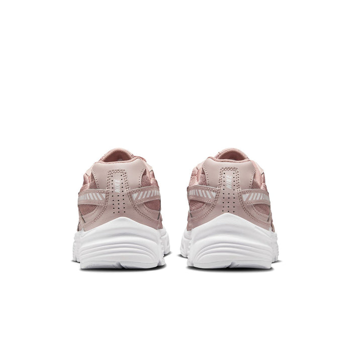 Women's dusty pink sneakers from heel view with white cushioned midsole
