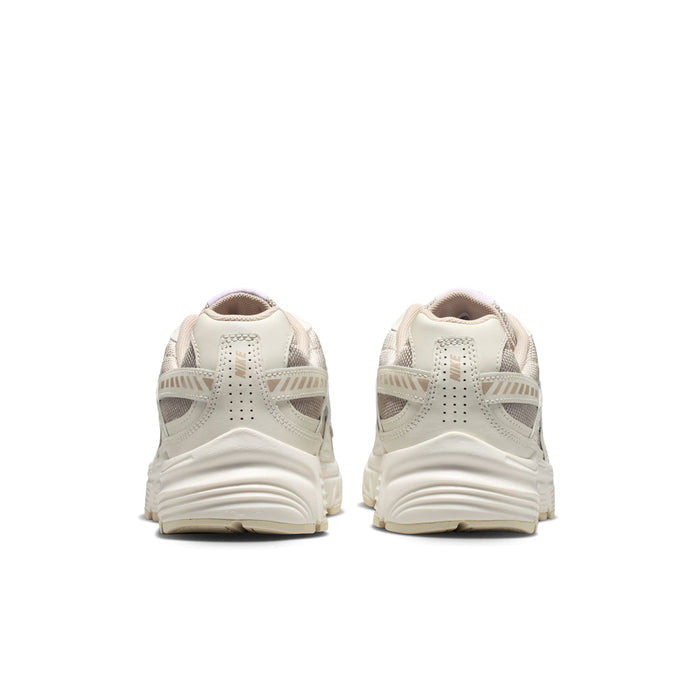 Women's cream and tan sneakers from the back with cushioned heel and pull tab