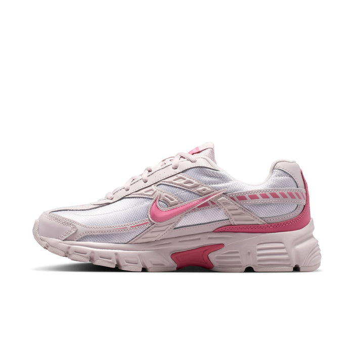 Light gray and pink women's sneaker, side profile with pink swoosh and overlays