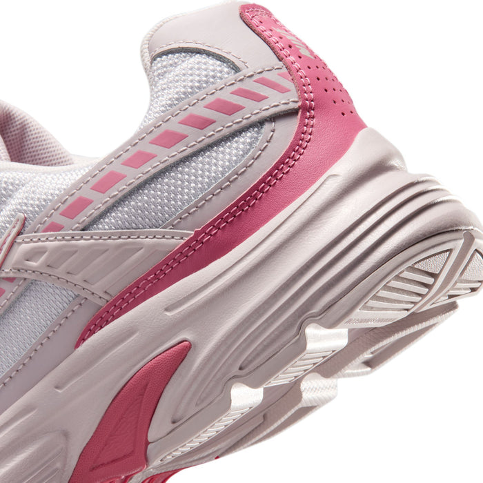 Light gray and pink women's sneaker, side panel detail and treaded rubber outsole