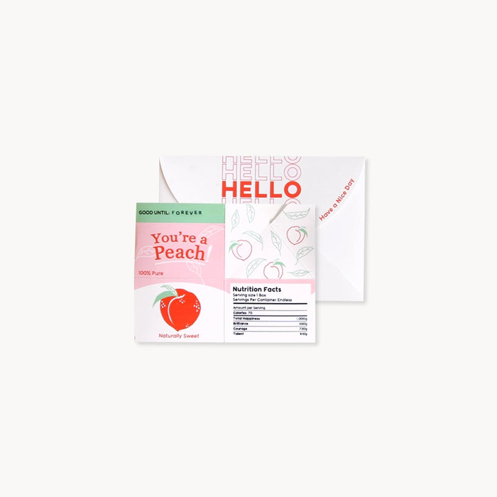 Juice box pop-up greeting card partially open, showing 'HELLO' and peach nutrition panel