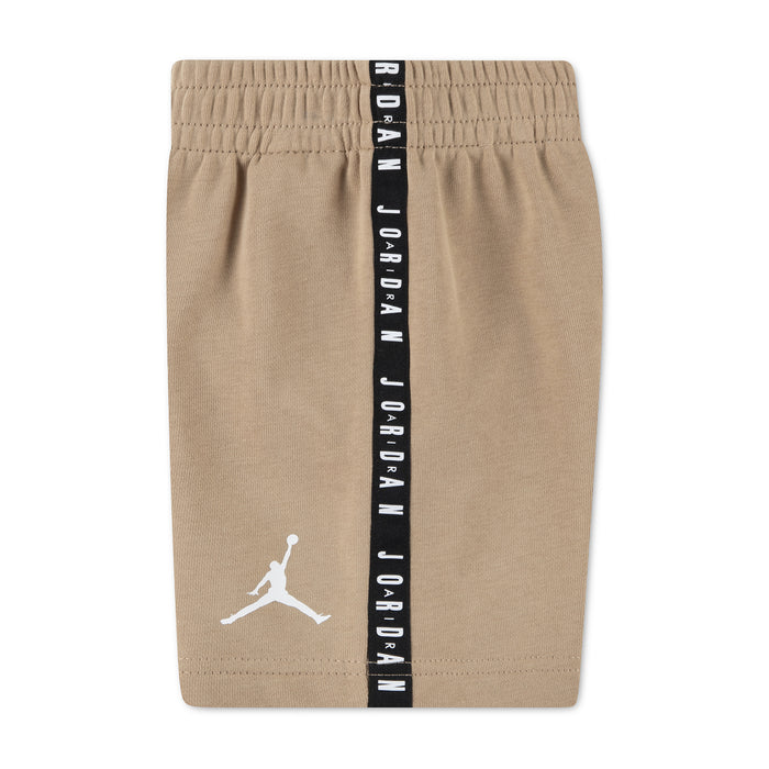 Beige toddler shorts with elastic waist and vertical black logo-tape with Jumpman