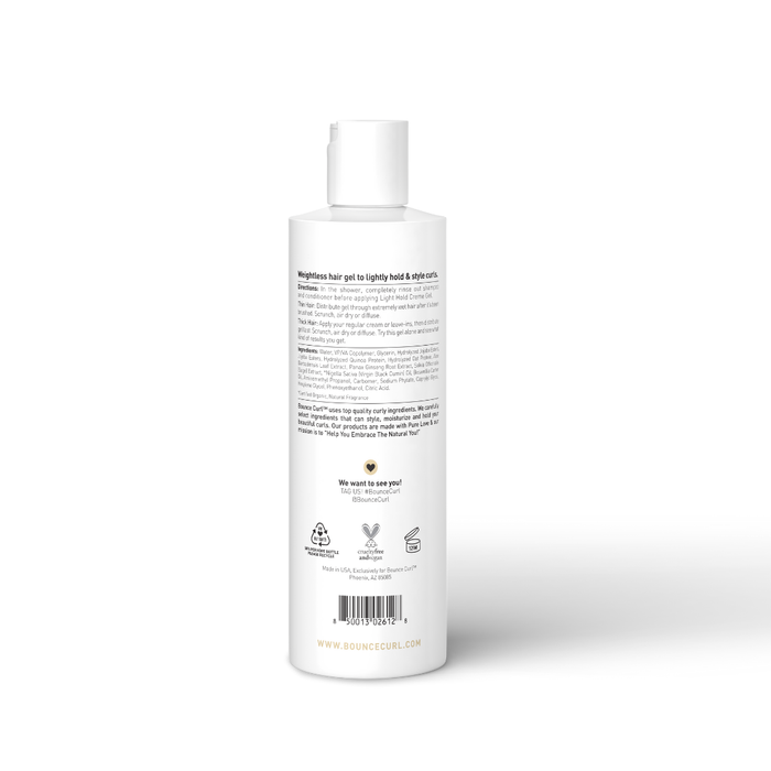 Bounce Curl applicator bottle standing on a peach background, label visible.