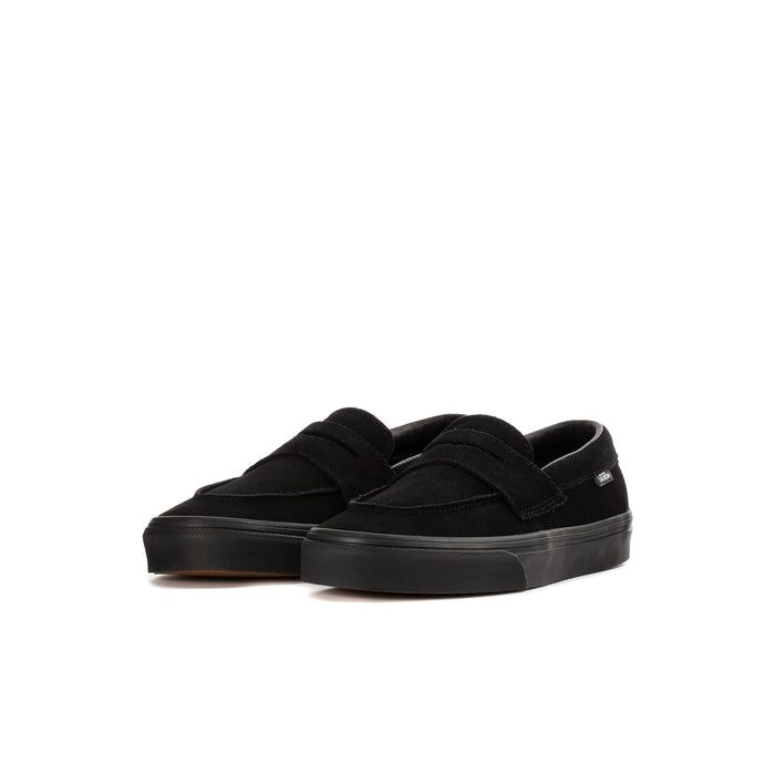 Kids' black Vans slip-on loafer, angled side view, padded collar, rubber sole