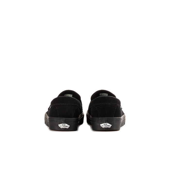 Kids' black Vans loafer heel view with rear seam and sidewall rubber sole