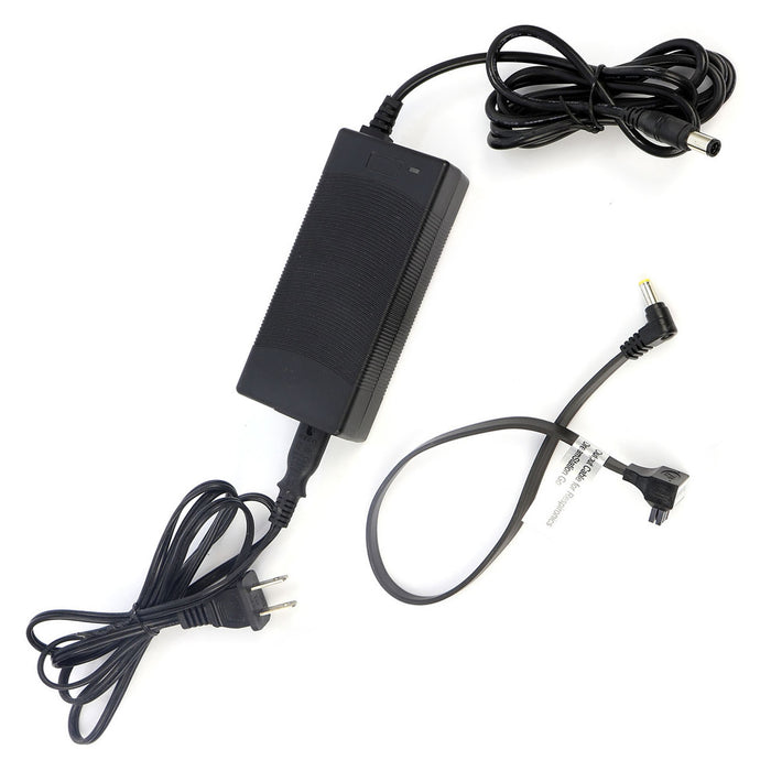Black power adapter with multiple cables on a white background