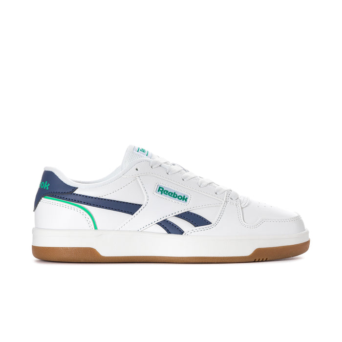Women's white sneaker with navy and green accents, gum sole