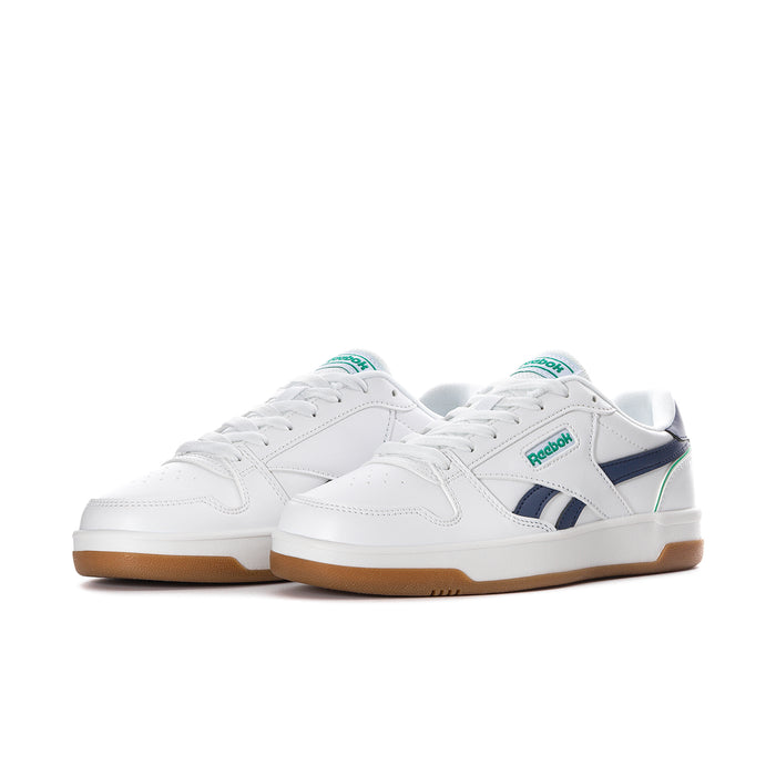 Women's white low-top sneaker, navy heel and green side stripe, gum sole