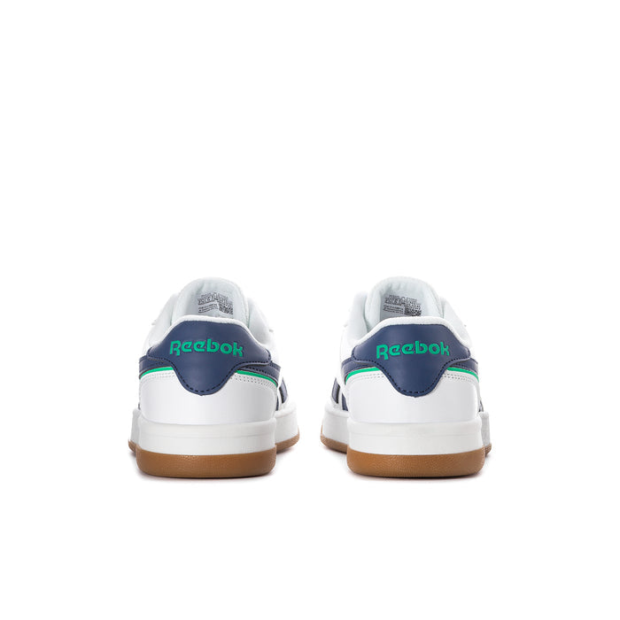 Women's white sneaker heel, navy collar with green Reebok logo, gum sole